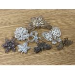 Four silver filigree brooches, one flower being a brooch/pendant together with Four silver