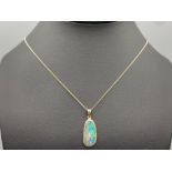 Ladies 14ct blue opal pendant complete with 9ct yellow gold chain, 2.7grm