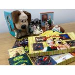 Wallace and Gromit collectors items to include a doorstop, novelty alarm clock, books & soft toys