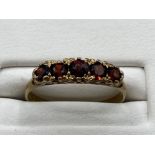 Ladies 9ct Yellow Gold 5 stone garnet ring, featuring 5 round garnets set across the ring, 1.5grm