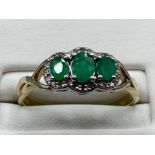 Ladies 9ct Yellow Gold emerald and diamond cluster ring, featuring 3 oval emeralds surrounded by