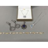 Sterling silver jewellery items including earrings, bracelet, pendants and chains