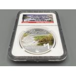 2014 Tuvalu silver $1 American alligator coloured early release coin. Graded and sealed by NGC