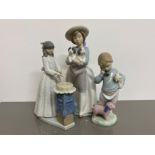 3x Nao by Lladro figures includes 1156 what an armful, 4899 cutting the cake and 1044 boy on the