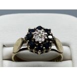 Silver gilt sapphire and diamond cluster ring size N weighing 2.7 grams