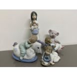 4x Nao by Lladro figures includes 1076 Not hungry, 1117 a new doll, 1477 big bear hug & 1476 rock me