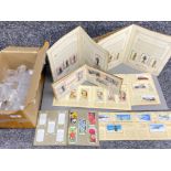 Box containing cigarette card albums and clear plastic protective tubs