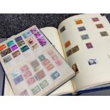 2 x albums of miscellaneous uncirculated stamps from around the world