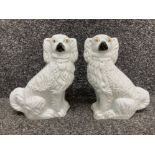 A pair of Staffordshire style fire dogs