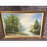 Large oil painting of a lake with birds indistinctly signed in gilt frame