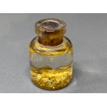 Small glass phial of gold flakes