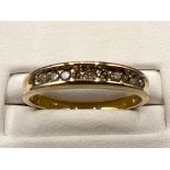 Ladies 9ct gold 11 stone diamond band. Approx 0.25ct 2.3G size O