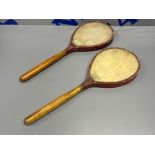 Good pair of antique ping pong paddles circa 1900 with wood frames and vellum covered leather wrap