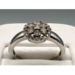 Ladies 9ct white gold diamond cluster ring. Comprising of 27 round brilliant cut diamonds 2.8g