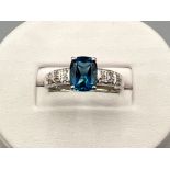 Ladies 9ct white gold blue topaz and diamond ring. 3.2g size R