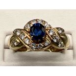 Ladies 9ct gold white and blue stone cluster ring. 5.3G size P