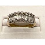 Ladies 9ct gold diamond band ring. Comprising of 19 baguette cut diamonds and 9 round brilliant