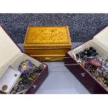 Pair of matching jewellery boxes including contents together with a carved wooden jewellery box