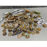 Tub containing a variety of lead dinosaur game pieces, (Triassic & Jurassic) including