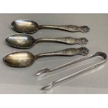 Tested silver sugar tongs 31.9G together with 3x silver plated American souvenir spoons -