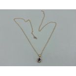 Ladies 9ct yellow gold sapphire and diamond pendant on 9ct gold chain 1.6g gross