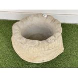 Large concrete garden planter in the form of a sack