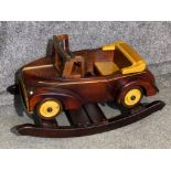 A hand carved wooden rocking car modelled on a British classic car, H49xL88cm