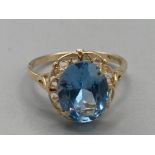 Ladies 9ct yellow gold oval shaped blue stone ring size J 2g gross