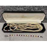 Lotus pearl box containing 3 pearl necklets (1 with 9ct gold clasp) and 2 pearl bracelets