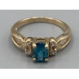 Ladies 9ct yellow gold blue topaz and CZ ring size P 3.1g gross