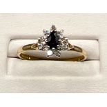 Ladies 9ct gold sapphire and white stone cluster ring. Size Q (1.6g)