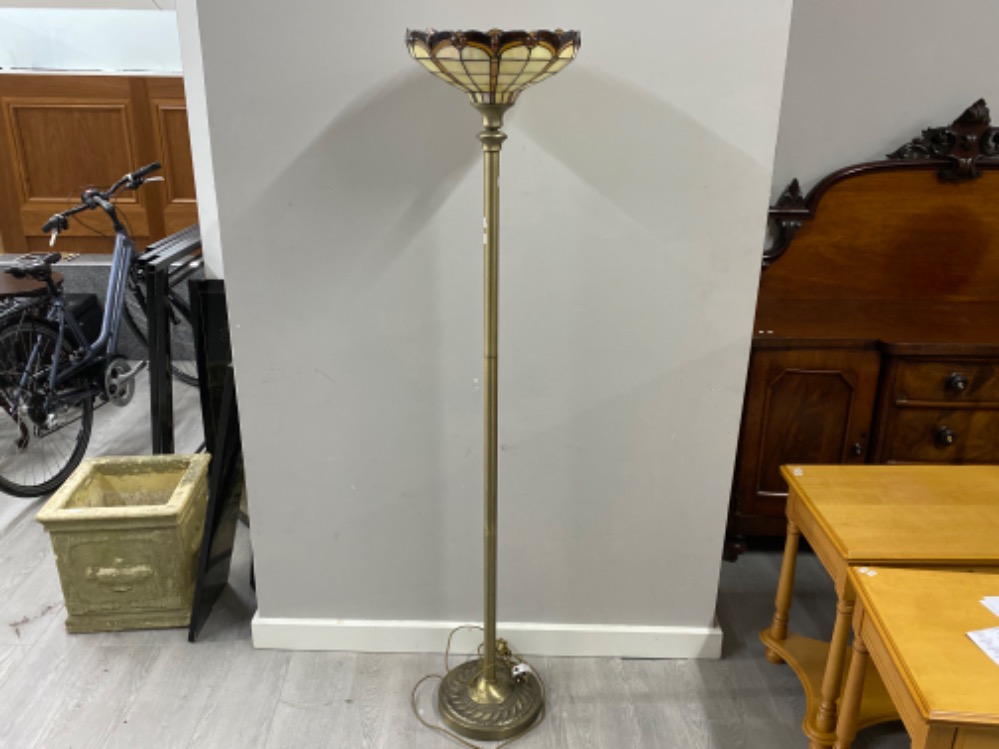 Contemporary pedestal uplighter on brass effect base with glass Tiffany style shade, Height 169cm