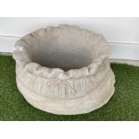 Large concrete garden planter in the form of a sack