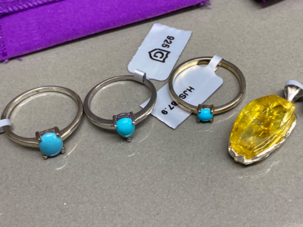 Three silver and turquoise rings by Gemporia sizes P R and T (5.5G) also includes silver and amber