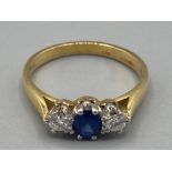 Ladies 18ct yellow gold sapphire and diamond three stone ring size M 2.9g gross