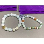 Two jadeite bracelets by Gemporia with COAs and slips