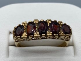 Ladies 9ct yellow gold 5 stone garnet ring, featuring 5 garnet stones set in a claw setting, 3.