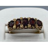 Ladies 9ct yellow gold 5 stone garnet ring, featuring 5 garnet stones set in a claw setting, 3.