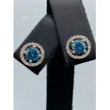 18ct White Gold Earrings comprising of a 1.40ct fancy coloured diamond center stone with 0.22ct