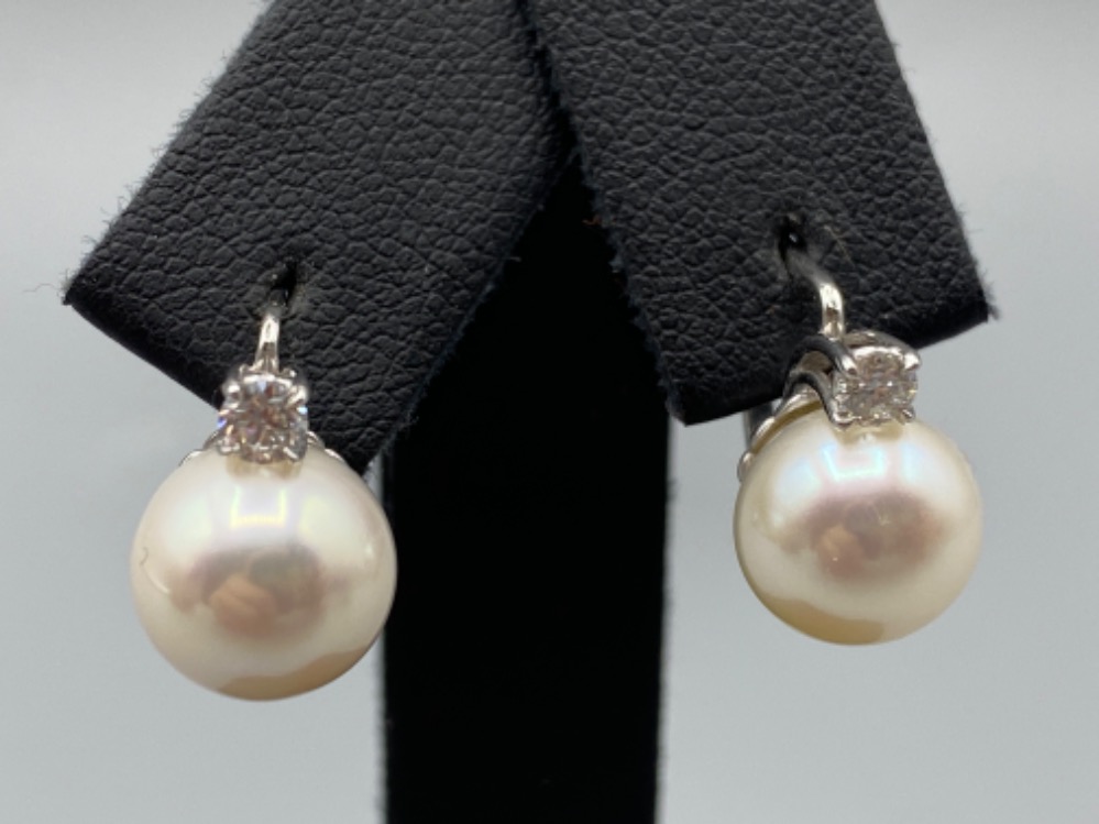 18ct White Gold Slight Drop Pearl and Diamond Earrings 0.21ct diamonds in total weighing 5.10 grams