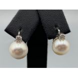 18ct White Gold Slight Drop Pearl and Diamond Earrings 0.21ct diamonds in total weighing 5.10 grams