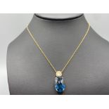 18ct Gold Blue Stone and Diamond Pendant (0.46ct) & Chain 42cm in length