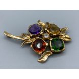 14ct Yellow Gold Multi Stone Brooch with a 0.15ct Diamond Centre Stone weighing 13.60 grams