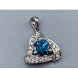 18ct White Gold Diamond Pendent comprising of a 0.90ct coloured diamond centre stone surrounded by