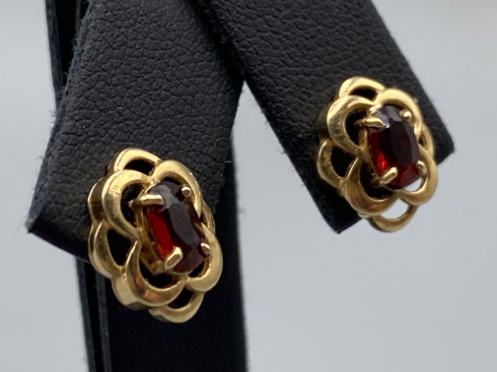 Ladies 9ct gold garnet stud earrings. Each set with a fancy setting. 1.4g - Image 2 of 3