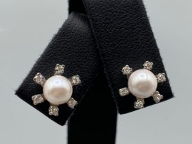 Beautiful Pearl Studs each surrounded by 6 small diamonds - 0.10cts total weighing 4.36 grams