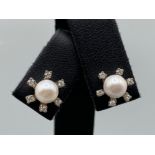 Beautiful Pearl Studs each surrounded by 6 small diamonds - 0.10cts total weighing 4.36 grams