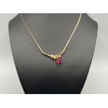 Ladies 9ct gold diamond and ruby set pendant necklace