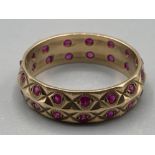 Ladies 9ct yellow gold and ruby band size O 3.1g gross