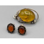 Silver amber oval brooch and amber stud earrings